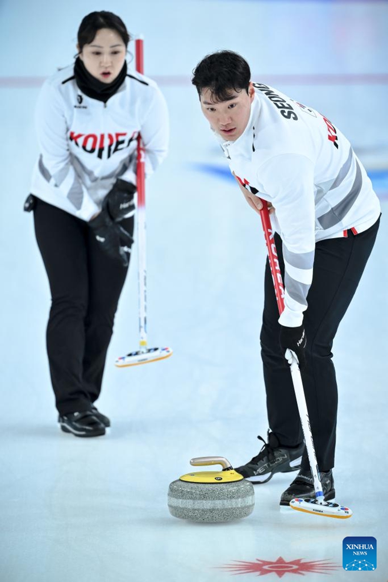 Kim Kyeongae (L)/Seong Jihoon of South Korea compete during the mixed doubles Round Robin Session 1 match between Kathleen Sumbillo Dubberstein/Marc Pfister of the Phillipines and Kim Kyeongae/Seong Jihoon of South Korea in the curling event at 2025 Asian Winter Games in Harbin, northeast China's Heilongjiang Province, Feb. 4, 2025. Photo: Xinhua