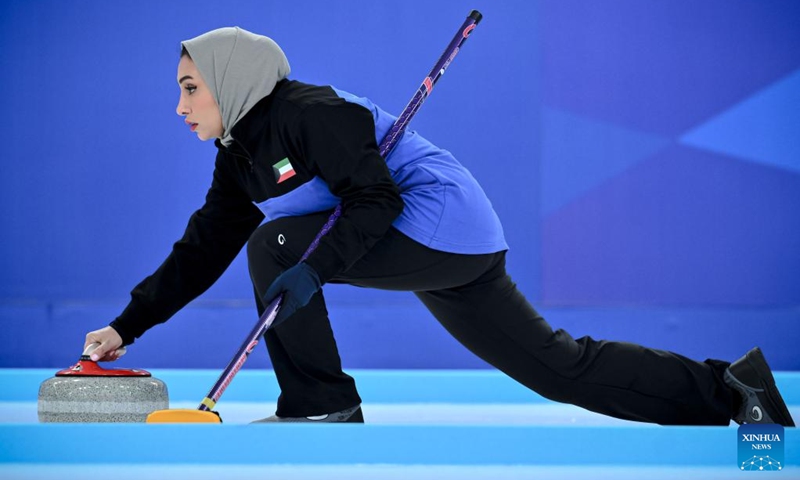 Fatema Abdulateef of Kuwait competes during the mixed doubles Round Robin Session 1 match between Fatema Abdulateef/Saud Alkandari of Kuwait and Enkhzaya Ganbat/Bayar Bulgankhuu of Mongolia in the curling event at 2025 Asian Winter Games in Harbin, northeast China's Heilongjiang Province, Feb. 4, 2025. Photo: Xinhua