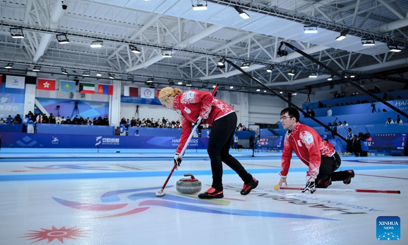 Koana Tori (L)/Aoki Go of Japan compete during the mixed doubles Round Robin Session 1 match against Chanatip Sonkham/Teekawin Jearateerawit of Thailand in the curling event at 2025 Asian Winter Games in Harbin, northeast China's Heilongjiang Province, Feb. 4, 2025. Photo: Xinhua