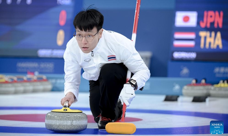 Teekawin Jearateerawit of Thailand competes during the mixed doubles Round Robin Session 1 match between Koana Tori/Aoki Go of Japan and Chanatip Sonkham/Teekawin Jearateerawit of Thailand in the curling event at 2025 Asian Winter Games in Harbin, northeast China's Heilongjiang Province, Feb. 4, 2025. Photo: Xinhua