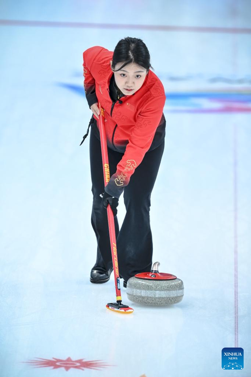 Han Yu of China competes during the mixed doubles Round Robin Session 1 match between Amina Seitzhanova/Azizbek Nadirbayev of Kazakhstan and Han Yu/Wang Zhiyu of China in the curling event at 2025 Asian Winter Games in Harbin, northeast China's Heilongjiang Province, Feb. 4, 2025. Photo: Xinhua