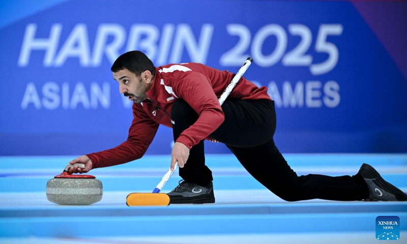 Nasser Abdulrahman Alyafei of Qatar competes during the mixed doubles Round Robin Session 1 match between Mabarka Al-Abdulla/Nasser Abdulrahman Alyafei of Qatar and Keremet Asanbaeva/Iskhak Abykeev of Kyrgyzstan in the curling event at 2025 Asian Winter Games in Harbin, northeast China's Heilongjiang Province, Feb. 4, 2025. Photo: Xinhua