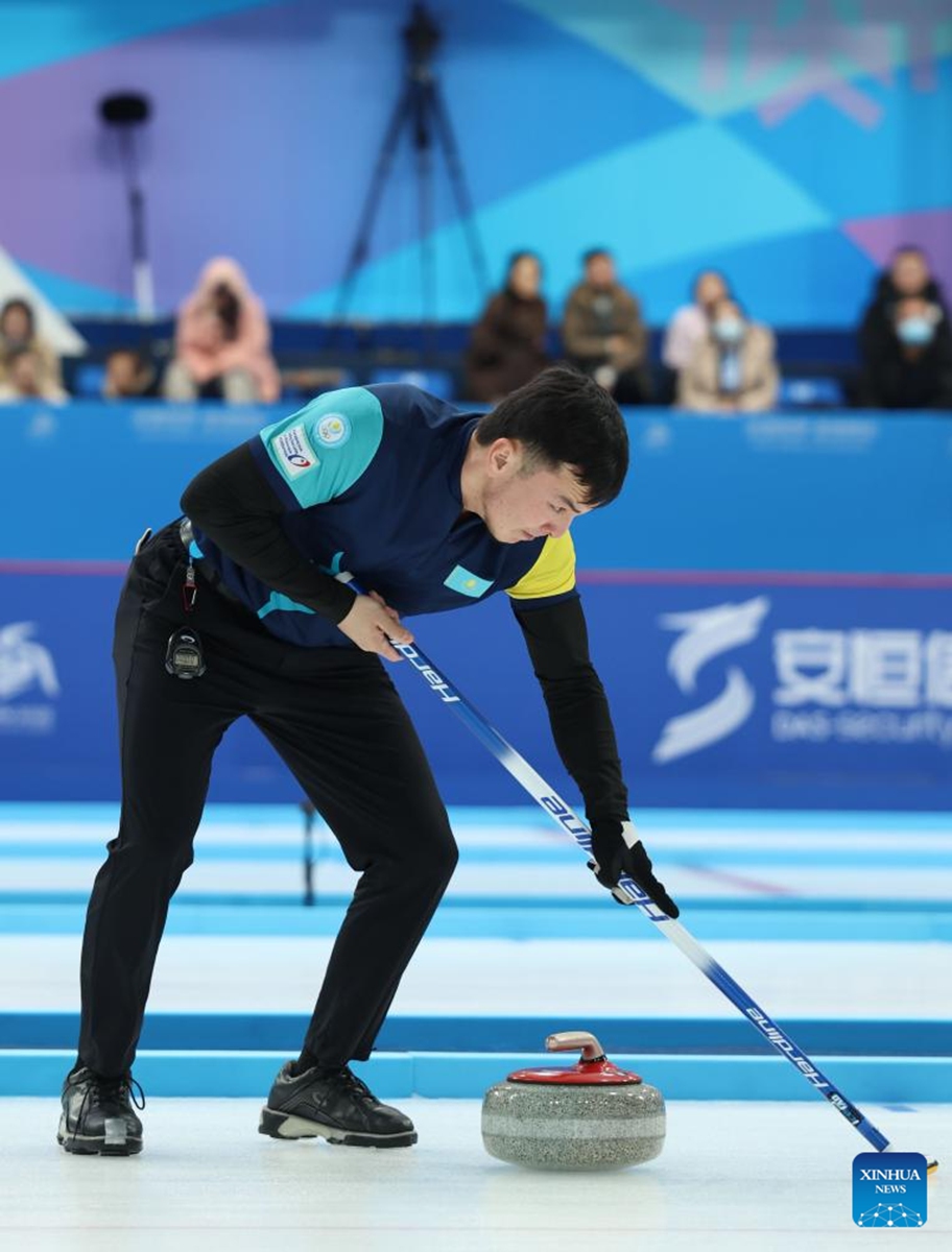 Azizbek Nadirbayev competes during the mixed doubles Round Robin Group B Session 5 match between Mabarka Salem Al-Abdulla/Nasser Abdulrahman Alyafei of Qatar and Amina Seitzhanova/Azizbek Nadirbayev of Kazakhstan in the curling event at 2025 Asian Winter Games in Harbin, northeast China's Heilongjiang Province, Feb. 5, 2025. Photo: Xinhua