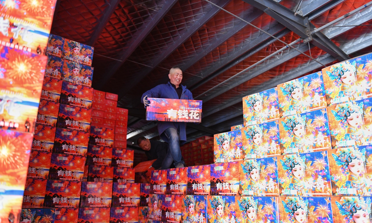  A worker carries firework products in Liuyang, Hunan Province, on January 17, 2025. Photo: VCG