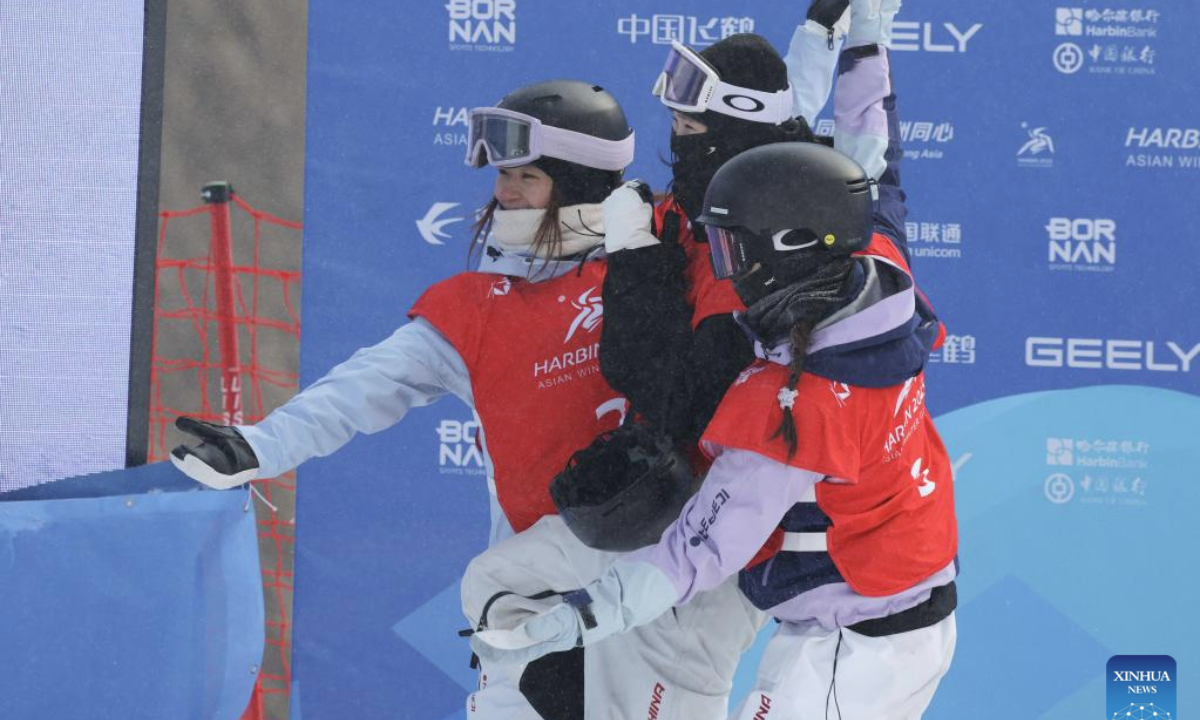 Han Linshan (R), Liu Mengting (C) and Yang Ruyi of China celebrate after the Freestyle Skiing women's freeski big air final match at the 9th Asian Winter Games in Yabuli, northeast China's Heilongjiang Province, Feb. 12, 2025. (Xinhua/Zhang Chenlin)

