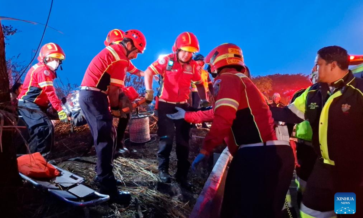 Rescuers work at the site of a bus accident in Guatemala City, Guatemala, on Feb. 10, 2025. At least 51 people were killed after a bus carrying 75 people plunged into a ravine in Guatemala City on Monday, the firefighters' spokesperson confirmed. (Str/Xinhua)