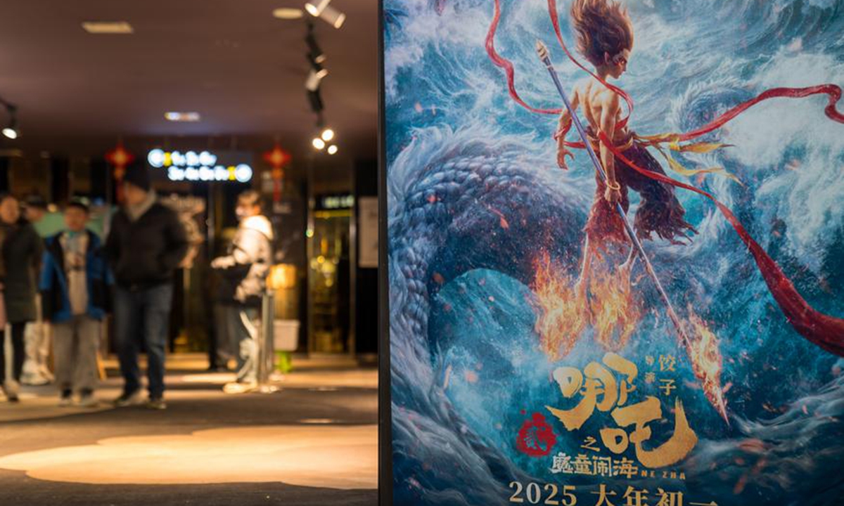 People walk out of a movie screening room at a cinema in Kunming, southwest China's Yunnan Province, Feb. 3, 2025. (Photo by Peng Yikai/Xinhua)