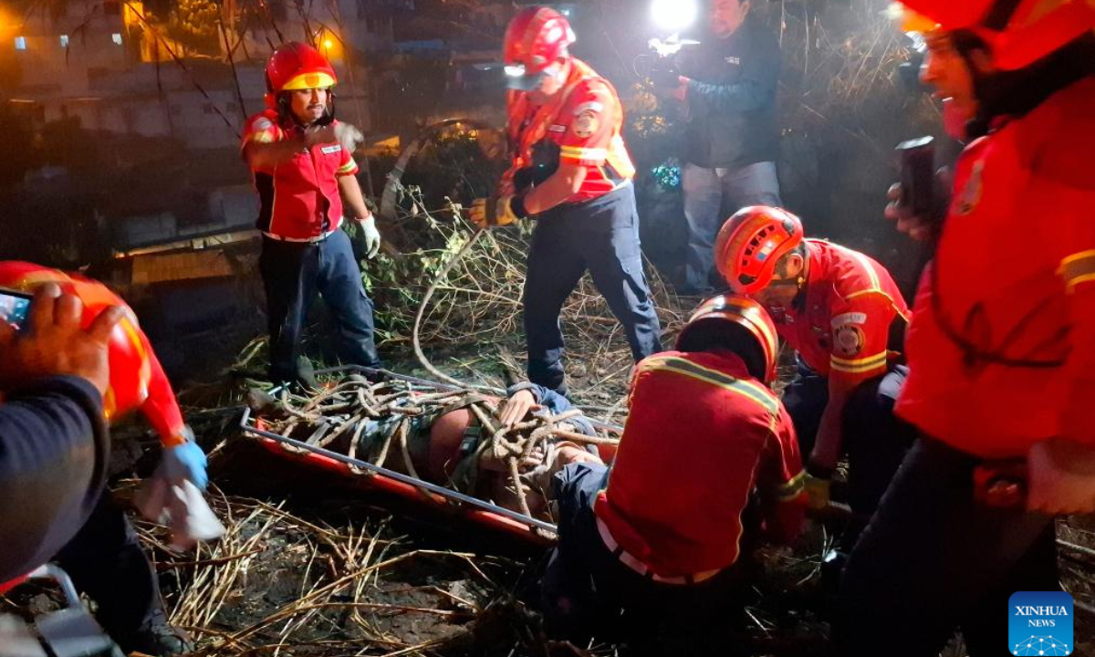 Rescuers work at the site of a bus accident in Guatemala City, Guatemala, on Feb. 10, 2025. At least 51 people were killed after a bus carrying 75 people plunged into a ravine in Guatemala City on Monday, the firefighters' spokesperson confirmed. (Str/Xinhua)