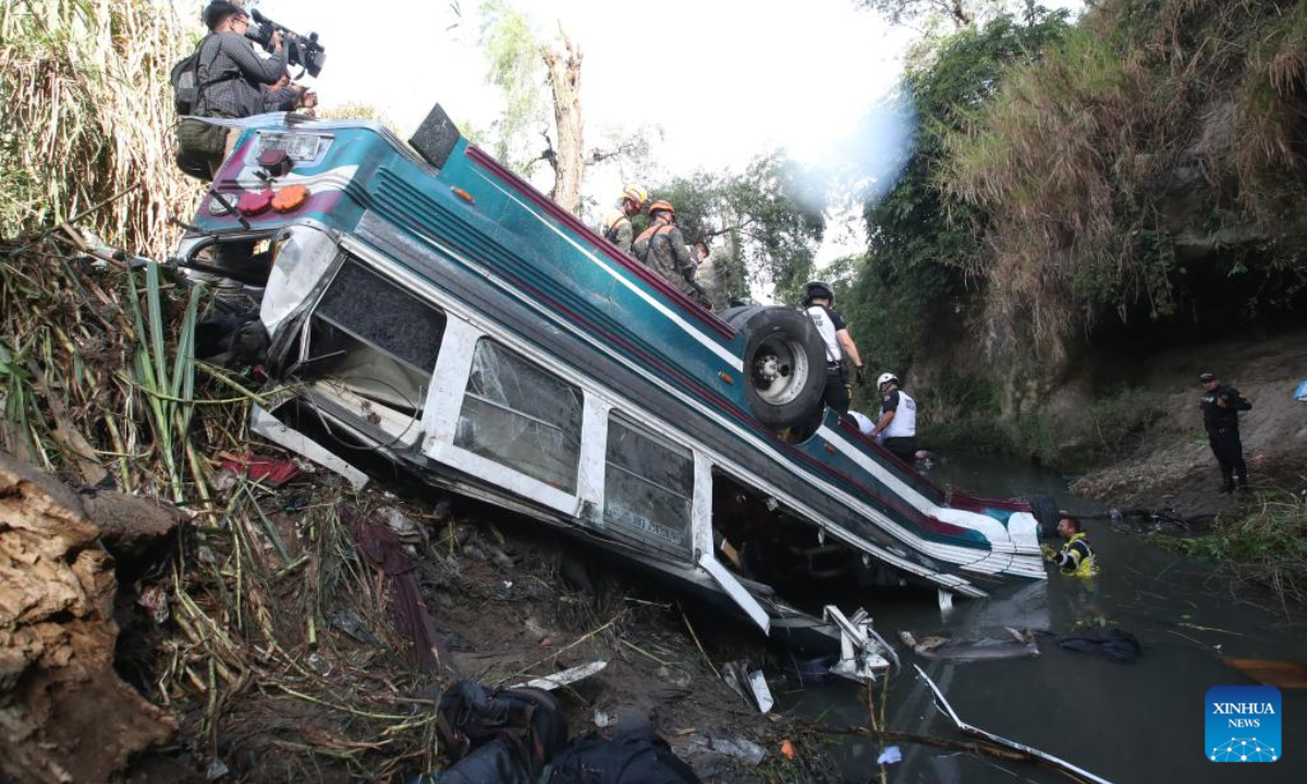 Rescuers work at the site of a bus accident in Guatemala City, Guatemala, on Feb. 10, 2025. At least 51 people were killed after a bus carrying 75 people plunged into a ravine in Guatemala City on Monday, the firefighters' spokesperson confirmed. (Str/Xinhua)