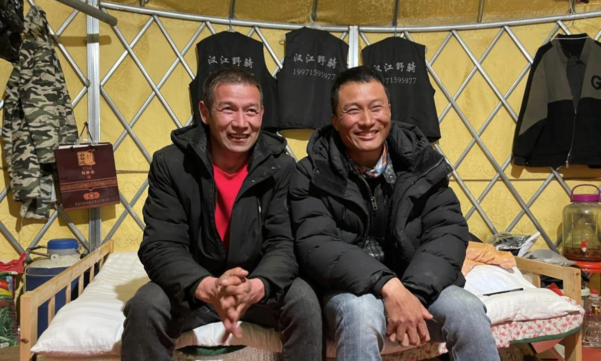 Yelibay Dosunbek (L) and Su Shaogao are pictured at their equestrian club hours after they rescued a man from the Hanjiang River in the city of Xiantao, central China's Hubei Province, on Feb. 4, 2025. (Photo by Liu Xianshuang/Xinhua)