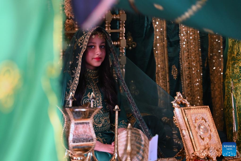 A girl wearing a traditional dress is pictured during a heritage promoting event at Al Bahhar Entertainment Historical Village in Kuwait City, Kuwait, Feb. 13, 2025. (Photo: Xinhua)