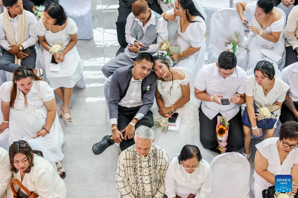 Brides and grooms attend a mass wedding ceremony on the eve of Valentine's Day in Quezon City, the Philippines, on Feb. 13, 2025. A total of 280 couples tied the knot in the annual event organized by the local government. (Photo: Xinhua)