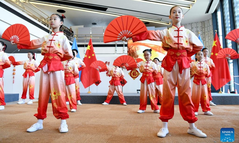 Children stage a Tai Chi fan performance during an event celebrating the Chinese Spring Festival at the Palais des Nations in Geneva, Switzerland, Feb. 12, 2025. This event featuring Tai Chi fan performances, paper-cutting, calligraphy, and lantern riddles was held here on Wednesday. It was organized by the Permanent Mission of China to the UN Office in Geneva and other international organizations in Switzerland. (Photo: Xinhua)