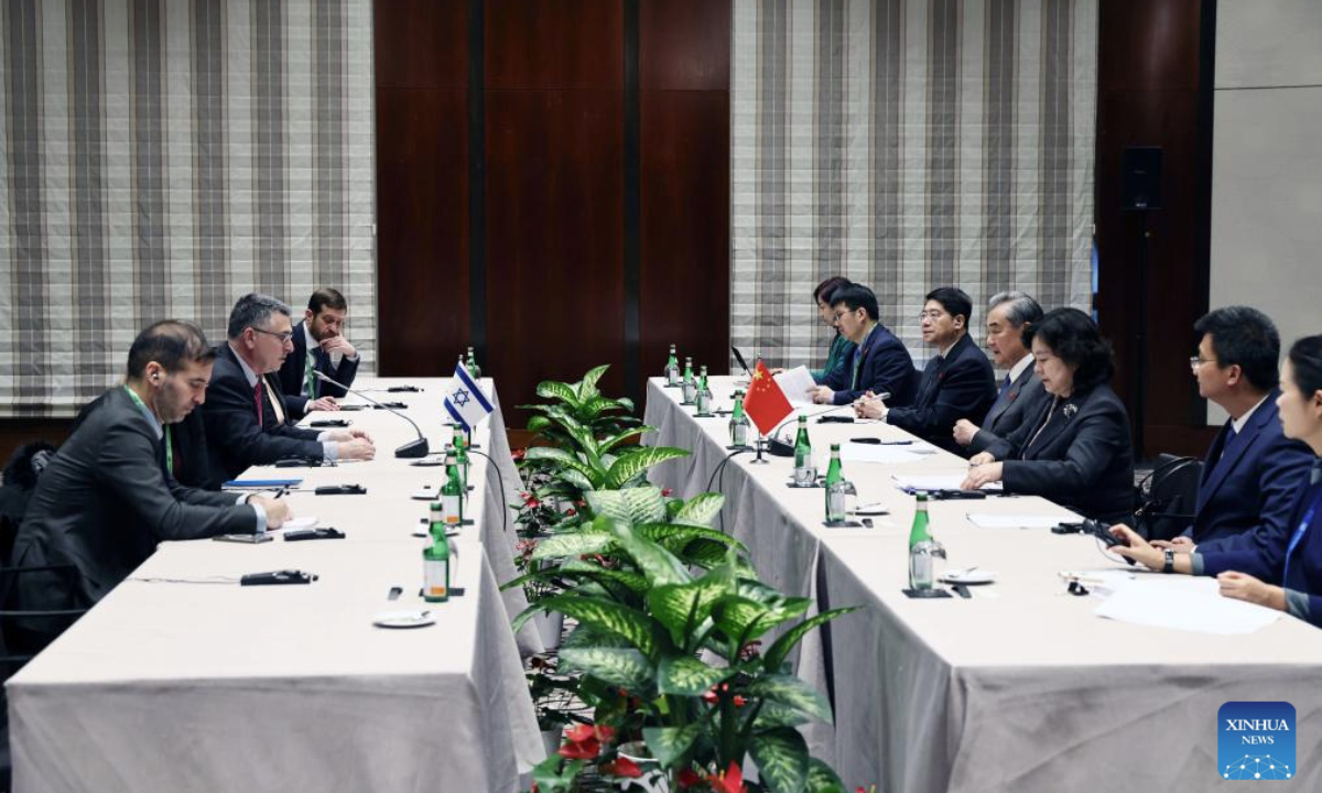 Chinese Foreign Minister Wang Yi, also a member of the Political Bureau of the Communist Party of China Central Committee, meets with Israeli Foreign Minister Gideon Sa'ar after attending the Munich Security Conference, in Munich, Germany, Feb. 15, 2025. (Xinhua/Gao Jing)