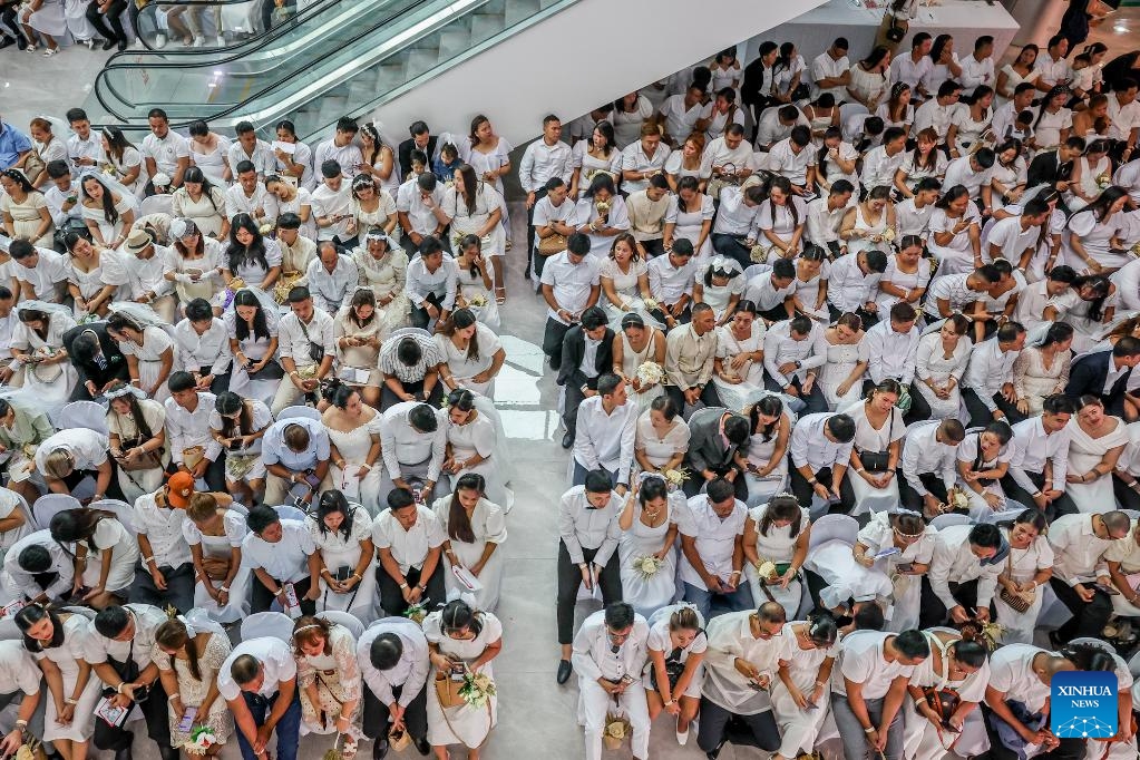 Brides and grooms attend a mass wedding ceremony on the eve of Valentine's Day in Quezon City, the Philippines, on Feb. 13, 2025. A total of 280 couples tied the knot in the annual event organized by the local government. (Photo: Xinhua)