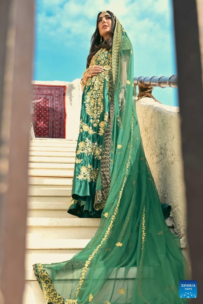 A girl wearing a traditional dress is pictured during a heritage promoting event at Al Bahhar Entertainment Historical Village in Kuwait City, Kuwait, Feb. 13, 2025. (Photo: Xinhua)