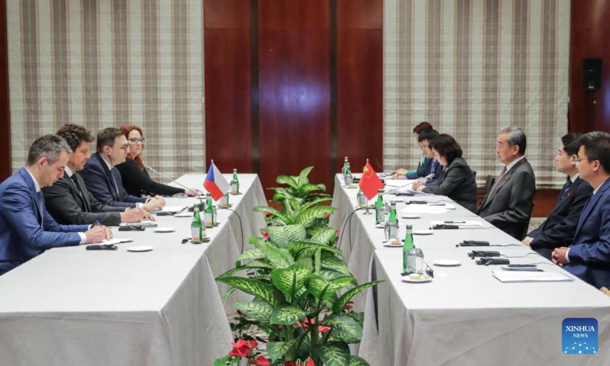 Chinese Foreign Minister Wang Yi, also a member of the Political Bureau of the Communist Party of China Central Committee, meets with Czech Foreign Minister Jan Lipavsky on the sidelines of the Munich Security Conference, in Munich, Germany, Feb. 15, 2025. (Xinhua/Zhang Fan)