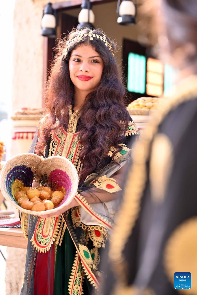 A girl wearing a traditional dress is pictured during a heritage promoting event at Al Bahhar Entertainment Historical Village in Kuwait City, Kuwait, Feb. 13, 2025. (Photo: Xinhua)