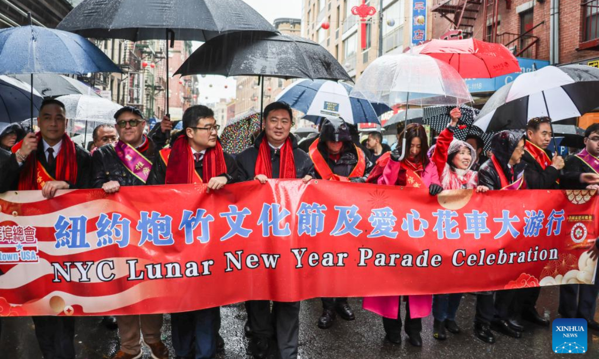 Chinese Consul General in New York Chen Li (4th L, front) is pictured during the Lunar New Year parade in New York City, the United States, Feb. 16, 2025.

The 27th Lunar New Year parade and festival returned to Chinatown in Lower Manhattan, New York City, on Sunday despite unusual downpours.

The rain didn't dampen the high spirits of the celebration's participants, who enjoyed a display of floats, bands and performances like dragon and lion dances. Thousands of people from far and near lined up the streets in Chinatown, and they also had a chance to patronize booths and restaurants in the area. (Photo by Winston Zhou/Xinhua)