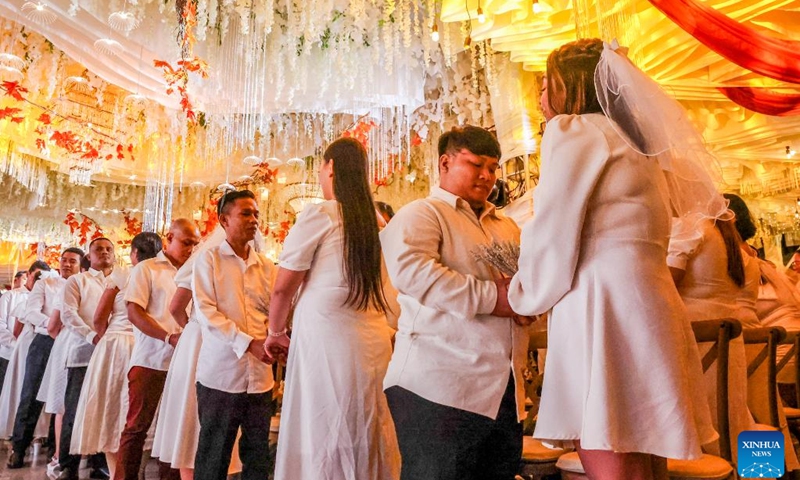 Brides and grooms attend a mass wedding ceremony on the eve of Valentine's Day in Quezon City, the Philippines, on Feb. 13, 2025. A total of 280 couples tied the knot in the annual event organized by the local government. (Photo: Xinhua)