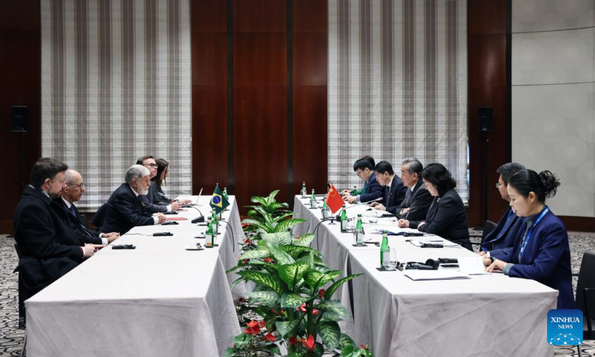 Chinese Foreign Minister Wang Yi, also a member of the Political Bureau of the Communist Party of China Central Committee, meets with Celso Amorim, special advisor to the president of Brazil, on the sidelines of the Munich Security Conference in Munich, Germany, Feb. 15, 2025. (Xinhua/Gao Jing)