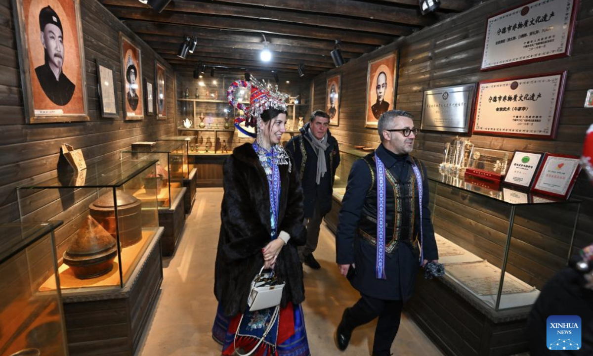 Italian guests visit a museum introducing folk customs of the She ethnic group in Banyueli Village, Xinan Town of Xiapu County, southeast China's Fujian Province, Feb. 20, 2025. A delegation from Sardinia, Italy visited the village on Thursday, experiencing the unique She ethnic group culture and customs. (Xinhua/Jiang Kehong)