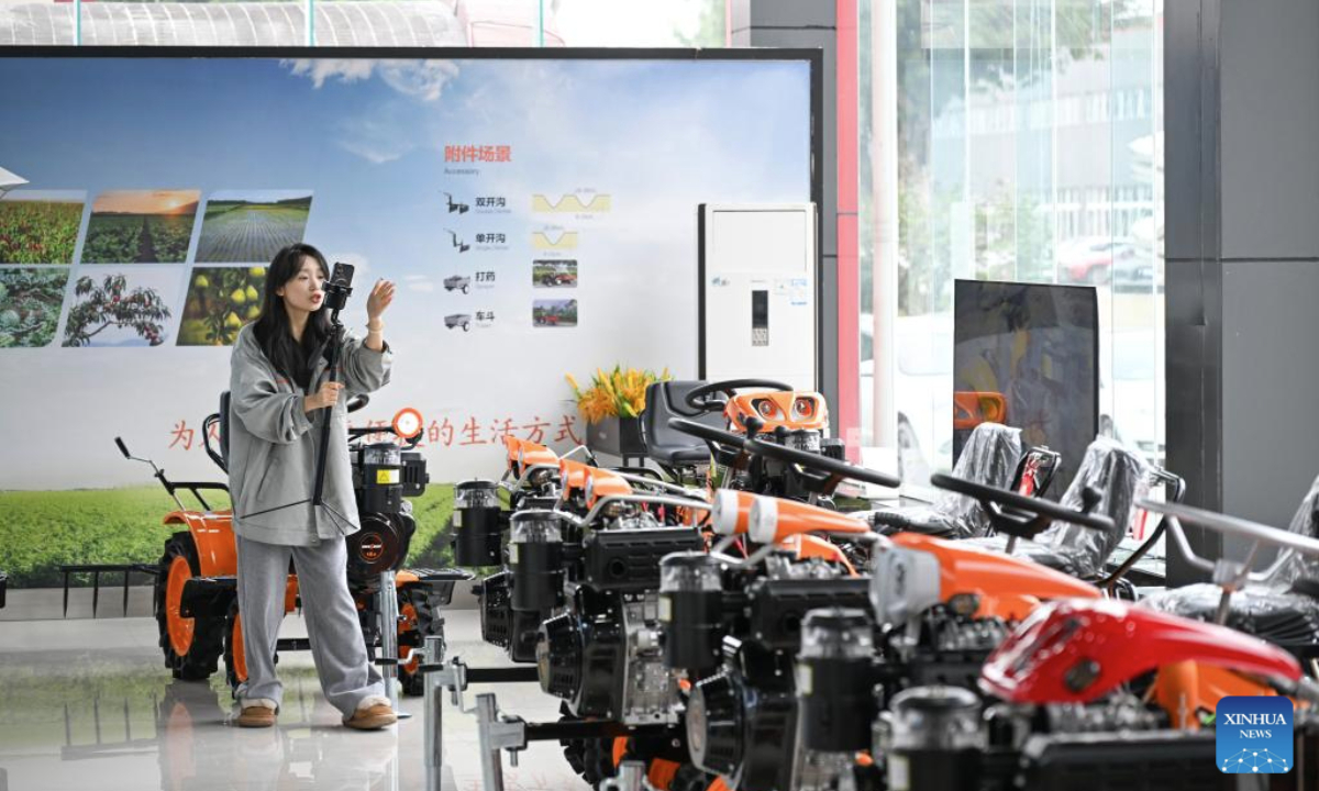 A saleswoman promotes agricultural machines via livestreaming at an exhibition hall of Chongqing Hwasdan Machinery Manufacturing Co., Ltd. in southwest China's Chongqing Municipality, Feb. 22, 2025. In recent years, the local government has launched a series of policies for the high-quality development of the city's private sector, covering areas such as technological innovation, market expansion and financial support. In 2024, the economic value added of Chongqing's private sector reached 1.98 trillion yuan (about 273 billion U.S. dollars). (Xinhua/Wang Quanchao)