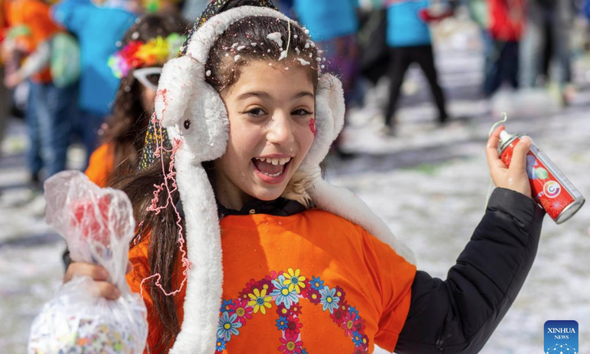 A child attends the Nicosia Carnival parade in Nicosia, Cyprus, on Feb. 23, 2025. (Photo by George Christophorou/Xinhua)