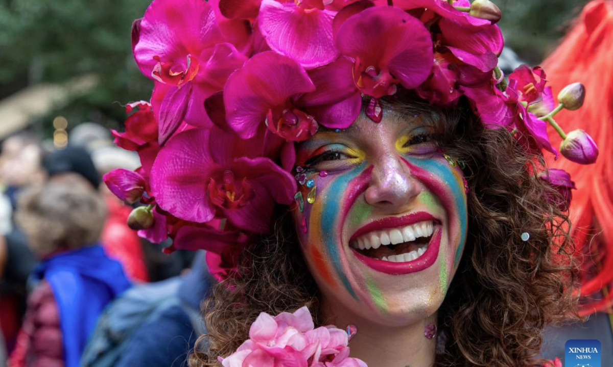 A person in costumes enjoys carnival festivities in Athens, Greece, Feb. 23, 2025. (Xinhua/Marios Lolos)