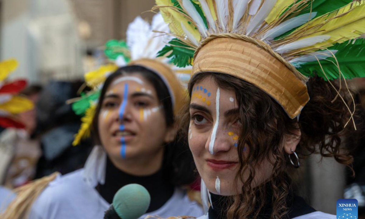 People dressed in costumes enjoy carnival festivities in Athens, Greece, Feb. 23, 2025. (Xinhua/Marios Lolos)