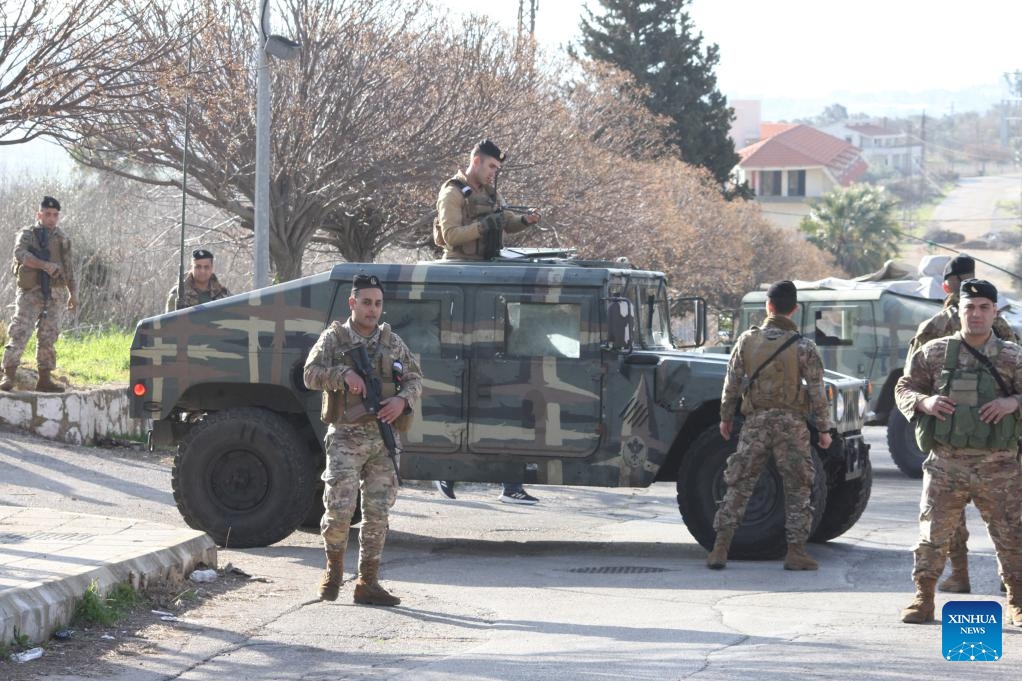 This photo taken on Feb. 18, 2025 shows members of the Lebanese army positioning at the entrance to Kfar Kila, Lebanon, after the Israeli army withdrew from it. An Israeli government official said Monday that the country's military will maintain troops at five posts in southern Lebanon, despite the deadline for its full withdrawal expiring on Tuesday. (Photo: Xinhua)