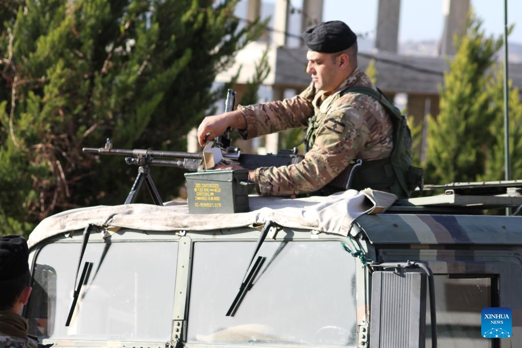 This photo taken on Feb. 18, 2025 shows members of the Lebanese army positioning at the entrance to Kfar Kila, Lebanon, after the Israeli army withdrew from it. An Israeli government official said Monday that the country's military will maintain troops at five posts in southern Lebanon, despite the deadline for its full withdrawal expiring on Tuesday. (Photo: Xinhua)