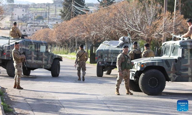 This photo taken on Feb. 18, 2025 shows members of the Lebanese army positioning at the entrance to Kfar Kila, Lebanon, after the Israeli army withdrew from it. An Israeli government official said Monday that the country's military will maintain troops at five posts in southern Lebanon, despite the deadline for its full withdrawal expiring on Tuesday. (Photo: Xinhua)