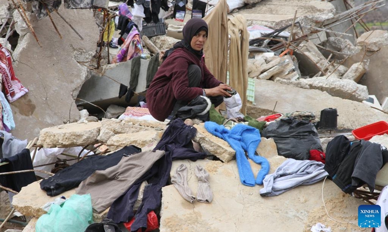 A woman returns to her destroyed home in Wazzani, Lebanon, on Feb. 19, 2025. The Israeli army withdrew from border areas of southern Lebanon on Tuesday but remained in five positions, an Israeli official said, despite the expiration of the deadline for a full withdrawal under a ceasefire agreement with Hezbollah. (Photo: Xinhua)