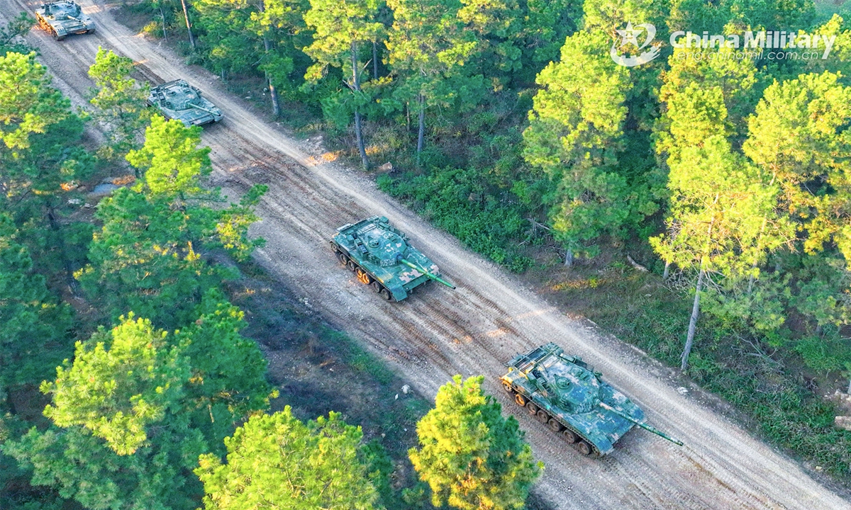 ZTZ-96 tanks attached to a tank element under a PLA Army brigade march on a muddy road during a recent maneuver training exercise. (eng.chinamil.com.cn/Photo by Zhao Genyuan)