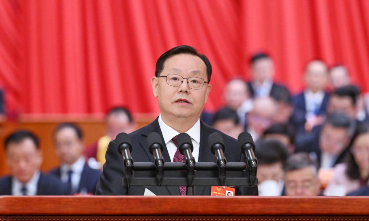 Jiang Zuojun delivers a report on how the proposals from political advisors have been handled since the second session of the 14th National Committee of the Chinese People's Political Consultative Conference (CPPCC) on behalf of the Standing Committee of the CPPCC National Committee at the opening meeting of the third session of the 14th CPPCC National Committee at the Great Hall of the People in Beijing, capital of China, March 4, 2025. (Xinhua/Rao Aimin)