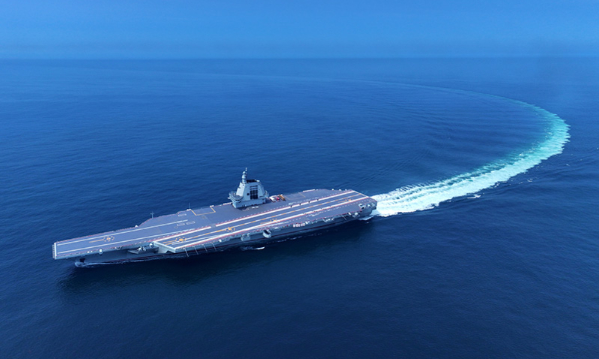 An aerial drone photo taken on May 7, 2024 shows China's third aircraft carrier, the <em>Fujian</em>, during its maiden sea trials. China's third aircraft carrier, the <em>Fujian</em>, completed maiden sea trials on Wednesday. (Photo:Xinhua)