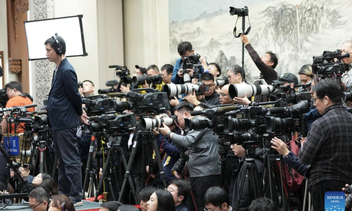 Journalists work at a press conference of the third session of the 14th National People's Congress (NPC) at the Great Hall of the People in Beijing, capital of China, March 4, 2025. The NPC, China's national legislature, held a press conference on Tuesday, one day ahead of the opening of its annual session. (Xinhua/Chen Yehua)