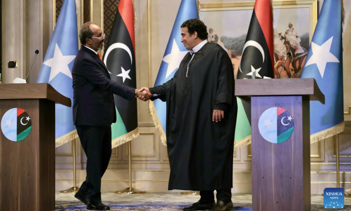 President of the Libyan Presidency Council Mohamed Menfi (R) shakes hands with Somali President Hassan Sheikh Mohamud during a press conference in Tripoli, Libya, on Feb. 24, 2025. President of the Libyan Presidency Council Mohamed Menfi emphasized the importance of Libya-Somalia cooperation during the press conference on Monday following talks with visiting Somali President Hassan Sheikh Mohamud. (Photo by Hamza Turkia/Xinhua)