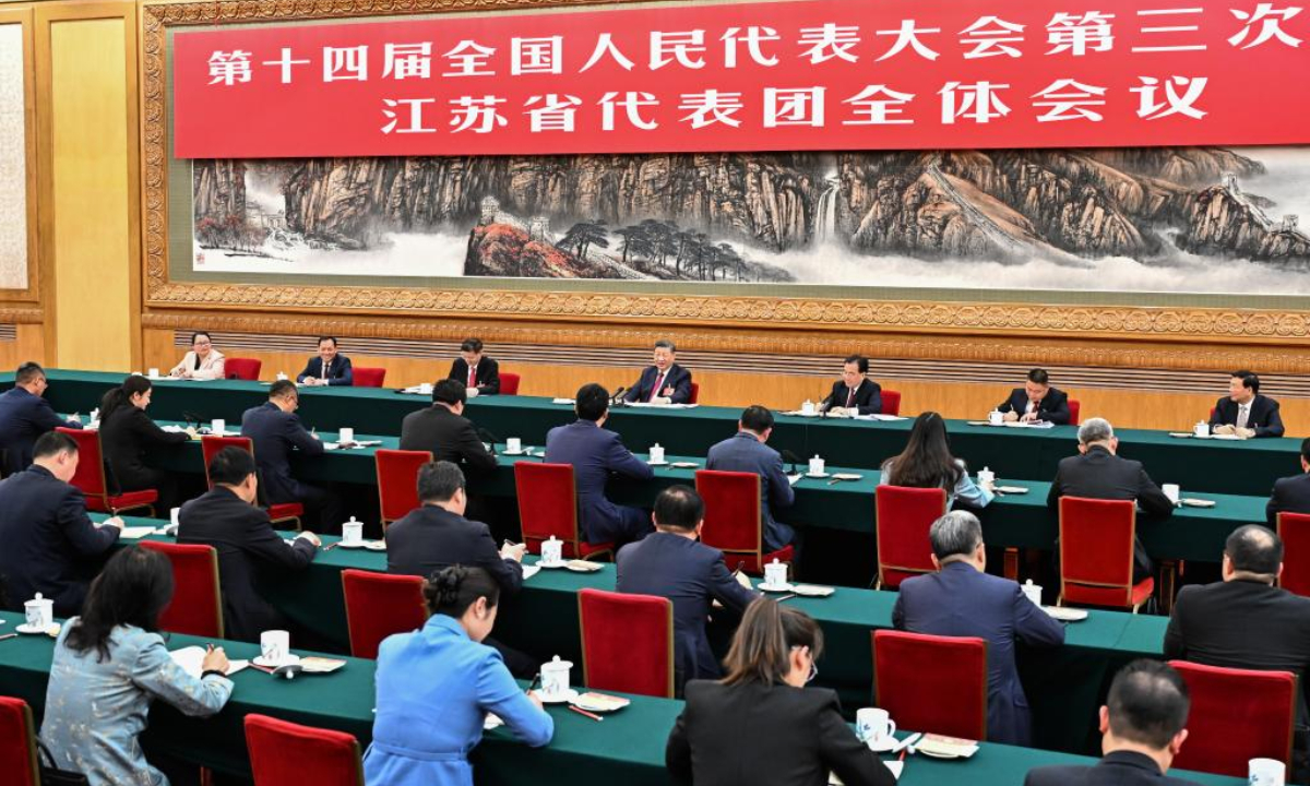 Chinese President Xi Jinping, also general secretary of the Communist Party of China Central Committee and chairman of the Central Military Commission, takes part in a deliberation with fellow lawmakers from Jiangsu during the third session of the 14th National People's Congress in Beijing, capital of China, March 5, 2025. (Xinhua/Yan Yan)