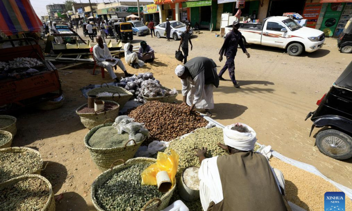 People shop for legumes and spices at Dongola Grand Market ahead of the holy month of Ramadan in Dongola, Sudan, Feb. 25, 2025. (Photo by Magdi Abdalla/Xinhua)