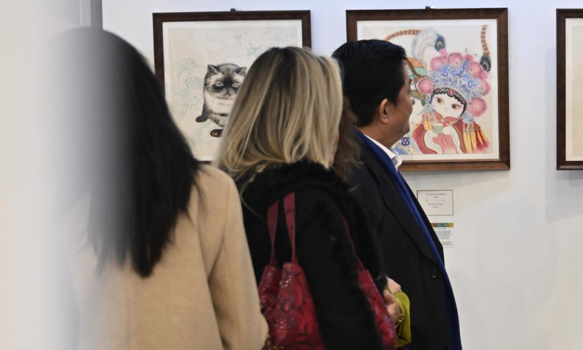 People visit an international art exhibition in Istanbul, Türkiye, on Feb. 24, 2025. The international art exhibition opened in Istanbul on Monday, highlighting the cultural connections among China, Türkiye, and other nations along the Silk Road. (Xinhua/Liu Lei)