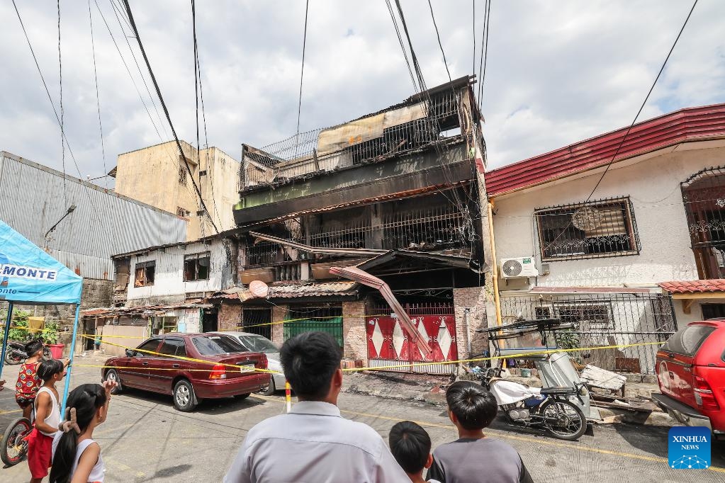 A charred house is seen after a fire in Quezon City, the Philippines, Feb. 27, 2025. Eight people were killed after a fire razed a three-storey residential building in the Philippine capital on Thursday, the Bureau of Fire Protection said. The bureau said the fire broke out early Thursday morning in Quezon City suburb while the occupants were fast asleep. (Photo: Xinhua)