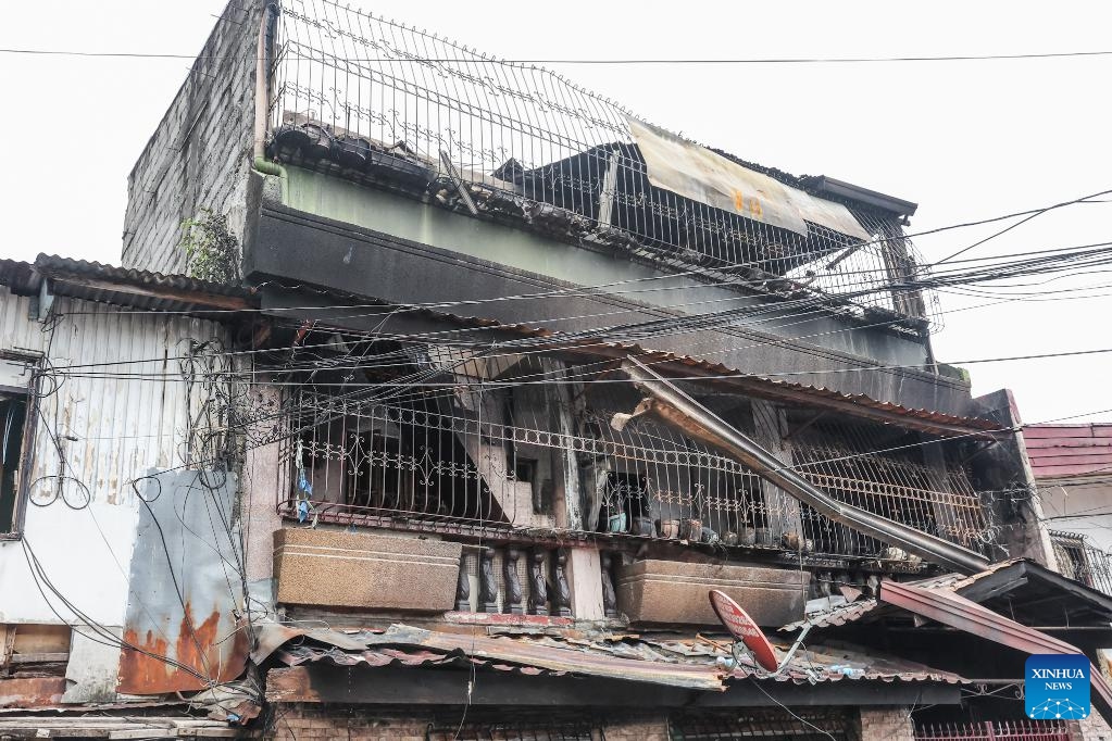 A charred house is seen after a fire in Quezon City, the Philippines, Feb. 27, 2025. Eight people were killed after a fire razed a three-storey residential building in the Philippine capital on Thursday, the Bureau of Fire Protection said. The bureau said the fire broke out early Thursday morning in Quezon City suburb while the occupants were fast asleep. (Photo: Xinhua)