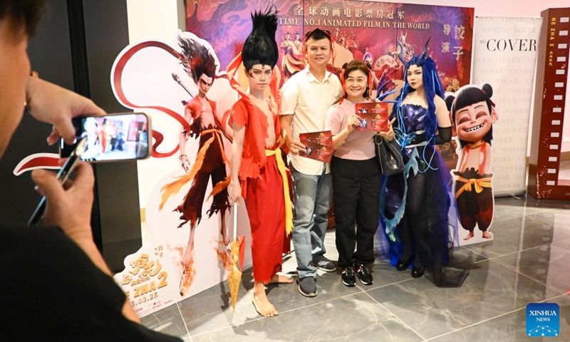 People pose for a photo during the premiere of the Chinese animated film Ne Zha 2 in Kuala Lumpur, Malaysia, March 8, 2025. Chinese animated film Ne Zha 2 premiered on Saturday in Malaysia. The film will be officially released in Malaysia on March 13. Photo: Xinhua