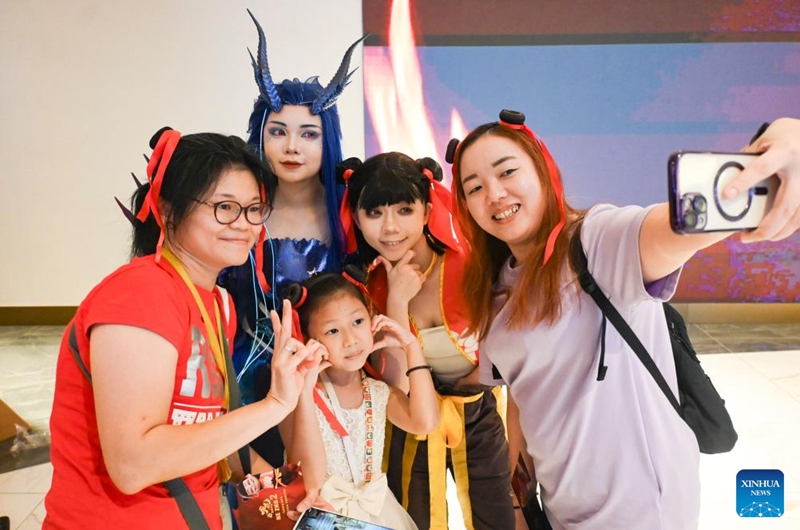 People pose for a selfie during the premiere of the Chinese animated film Ne Zha 2 in Kuala Lumpur, Malaysia, March 8, 2025. Chinese animated film Ne Zha 2 premiered on Saturday in Malaysia. The film will be officially released in Malaysia on March 13. Photo: Xinhua