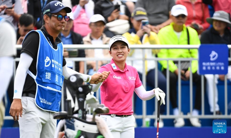 Jeeno Thitikul (R) of Thailand reacts before the third round of the Blue Bay LPGA golf tournament in Lingshui, south China's Hainan Province, March 8, 2025. Photo: Xinhua