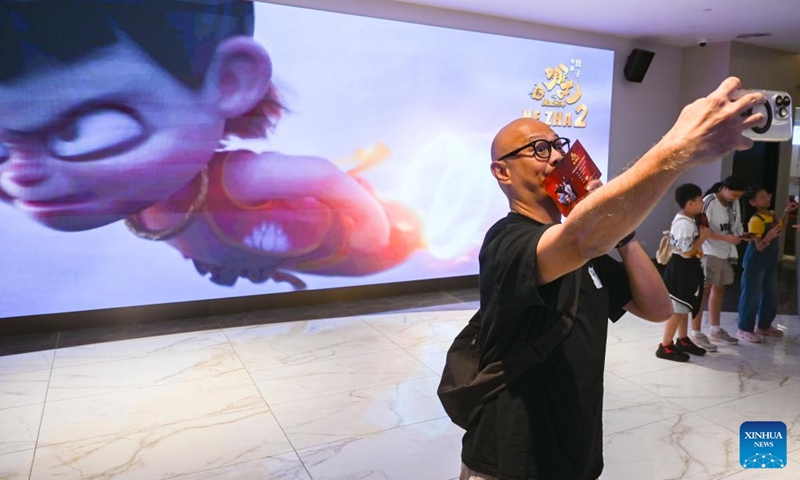 A man poses for a selfie during the premiere of the Chinese animated film Ne Zha 2 in Kuala Lumpur, Malaysia, March 8, 2025. Chinese animated film Ne Zha 2 premiered on Saturday in Malaysia. The film will be officially released in Malaysia on March 13. Photo: Xinhua