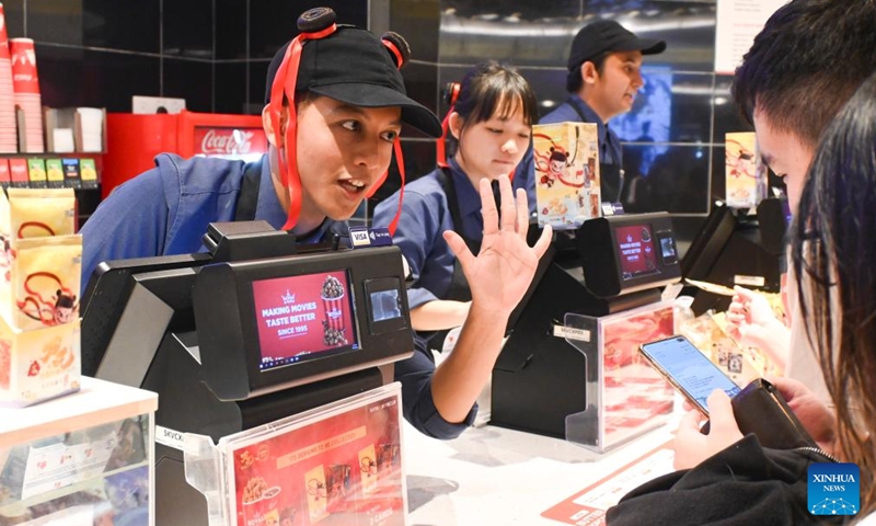 Staff members talk with audience during the premiere of the Chinese animated film Ne Zha 2 in Kuala Lumpur, Malaysia, March 8, 2025. Chinese animated film Ne Zha 2 premiered on Saturday in Malaysia. The film will be officially released in Malaysia on March 13. Photo: Xinhua