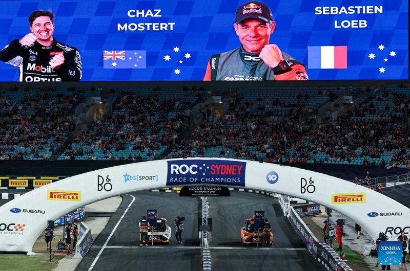 Sebastien Loeb (R) of France and Chaz Mostert of Australia prepare for the final of the Race of Champions (ROC) at Accor Stadium in Sydney, Australia, March 8, 2025. Photo: Xinhua